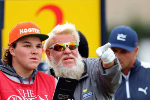 John Daly tees off for The Open with Hooters golf bag as his caddy, son John II, wears matching hat at St Andrews