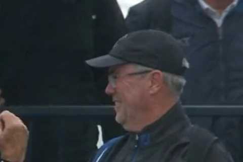 Hilarious moment as spectator at The Open gets trapped inside his own PONCHO during strong winds at St Andrews