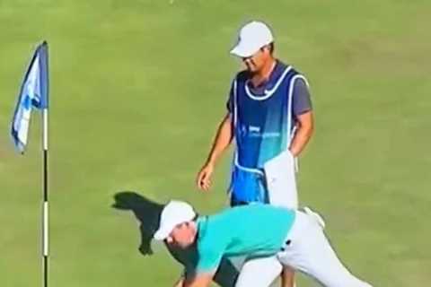 Watch fuming Rory McIlroy throw fan’s remote control golf ball into water before security kick supporter out