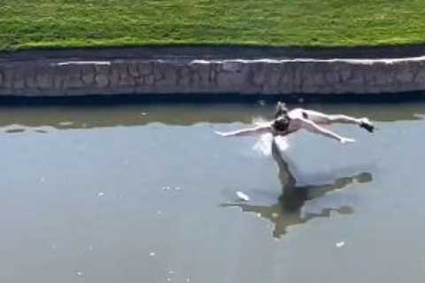 Watch streaker imitate stripper in just underwear on golf course at PGA Tour before belly flopping into pond