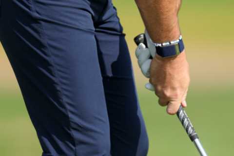 What is the correct way to hold a golf club?