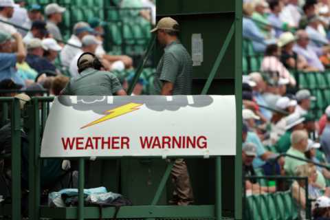 Huge thunder storm threatens to cause chaos at Masters with fears tournament could be extended to FIVE DAYS